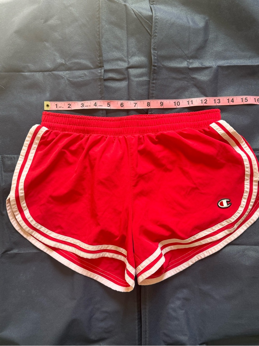 Champion Women’s Red Athletic Shorts with White Stripe Trim